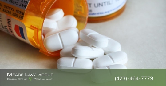 Prescription with medication coming out of a prescription bottle